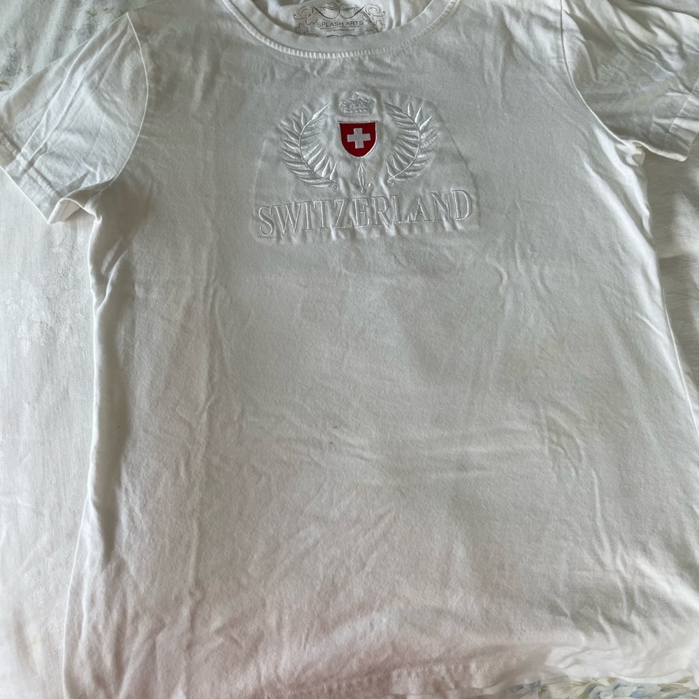 White new t-shirt from Switzerland. Never worn.Size small. A real nice shirt.